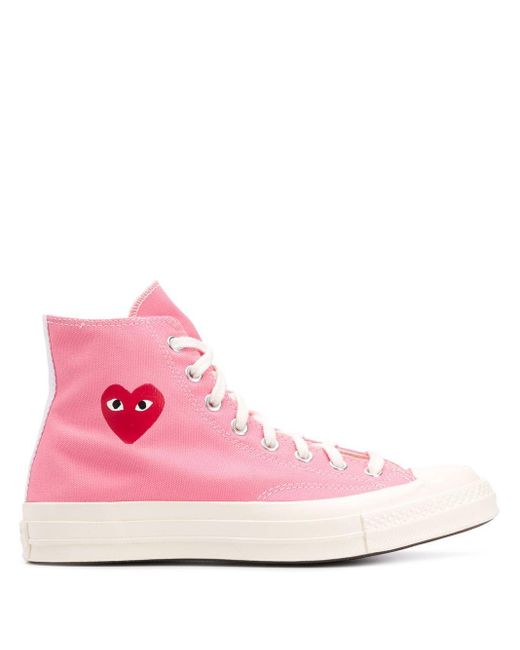 pink high top converse comme des garcons