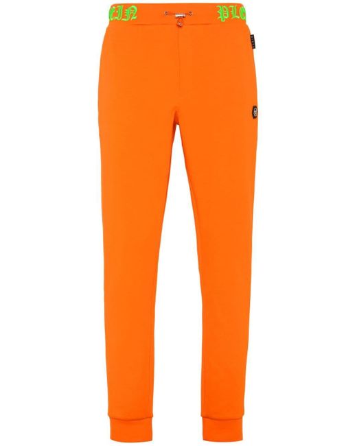 Pantaloni sportivi con logo Skull and Bones di Philipp Plein in Orange da Uomo