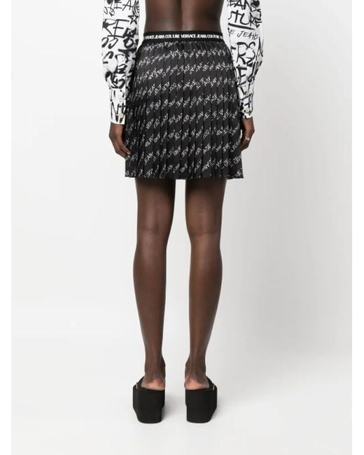 Minijupe Plissée À Logo Imprimé Versace Jeans Couture en coloris Black