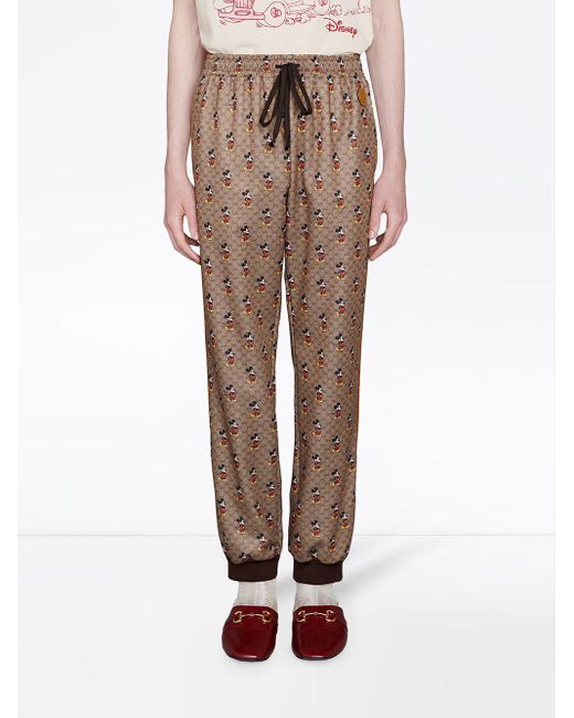 Gucci X Disney Monogram-print Track Pants in Brown for Men | Lyst