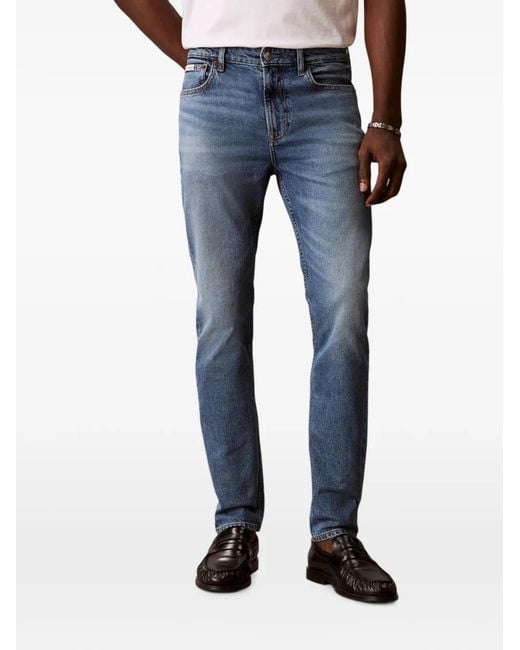 Calvin Klein Blue Whiskered Faded Jeans for men