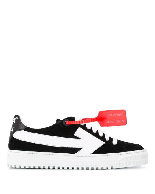 sneakers with arrow logo