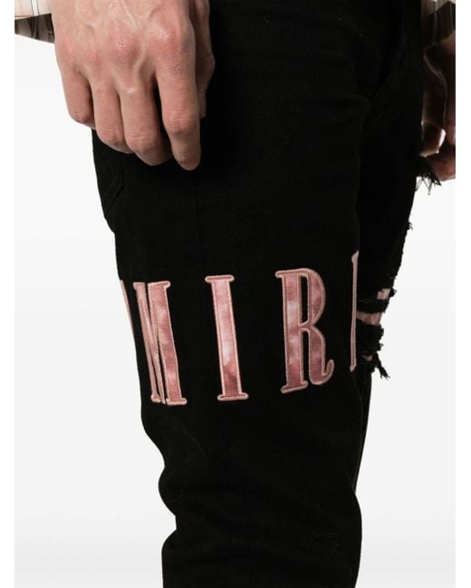 Amiri Skinny-Jeans mit Logo-Applikation in Black für Herren