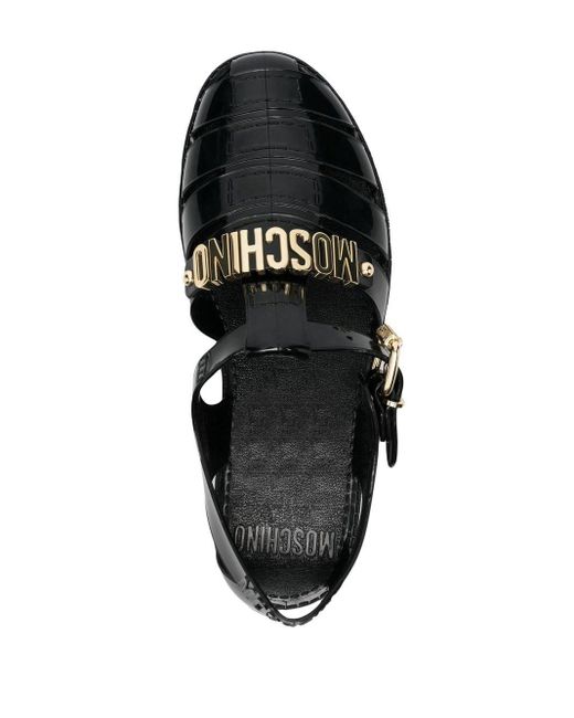 Sandalias con placa del logo Moschino de color Black