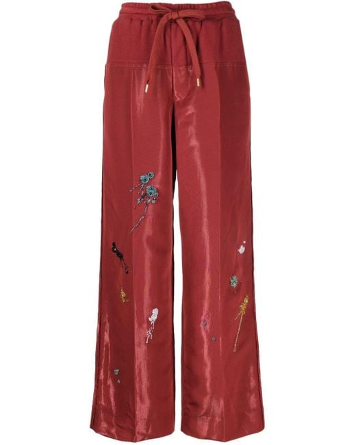Pantaloni a gamba ampia con ricamo di Undercover in Red