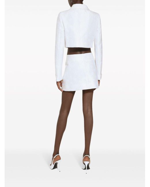 Minigonna con logo DG jacquard di Dolce & Gabbana in White