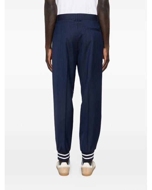 Moschino Blue Relaxed-Fit Pinstripe Trousers With Sporty Ribbed Cuffs for men