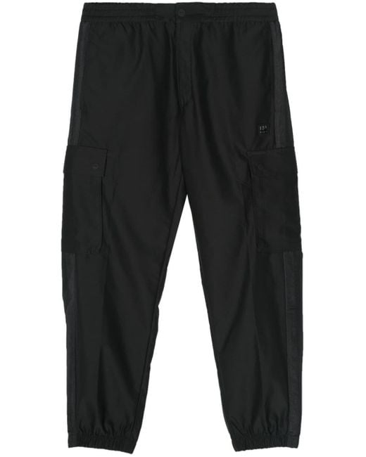 Pantaloni affusolati impermeabili di HUGO in Black da Uomo