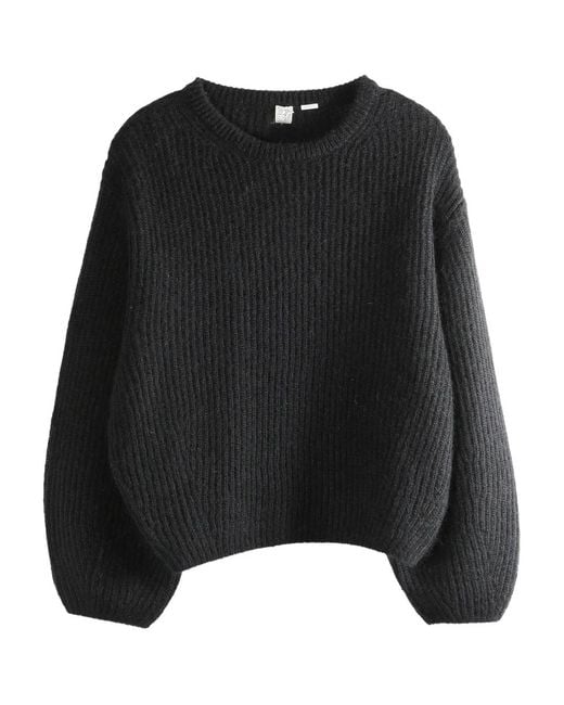 Pull Côtelé Totême en coloris Black