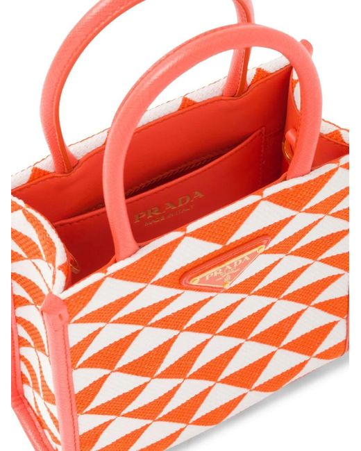 Borsa a mano Symbole micro in tessuto ricamato di Prada in Orange
