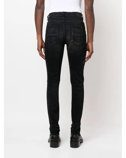Amiri Black Logo-Appliqué Distressed Jeans for men
