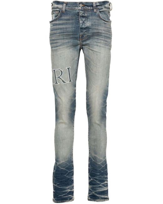 Jeans skinny con applicazione logo Core di Amiri in Blue da Uomo