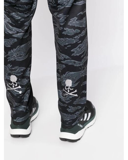 MASTERMIND WORLD Black Camouflage-Print Track Pants for men