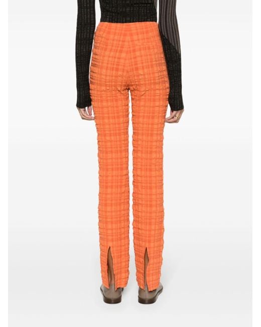 Pantalones de tejido seersucker Juna Nanushka de color Orange