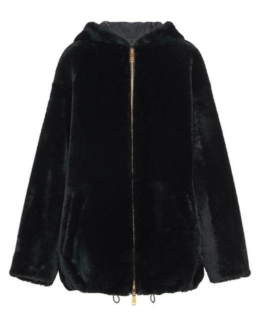 Veste en peau lainée à design réversible Prada en coloris Black
