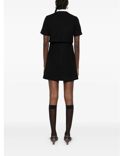 Vestido corto de tweed con detalle de botones Sandro de color Black