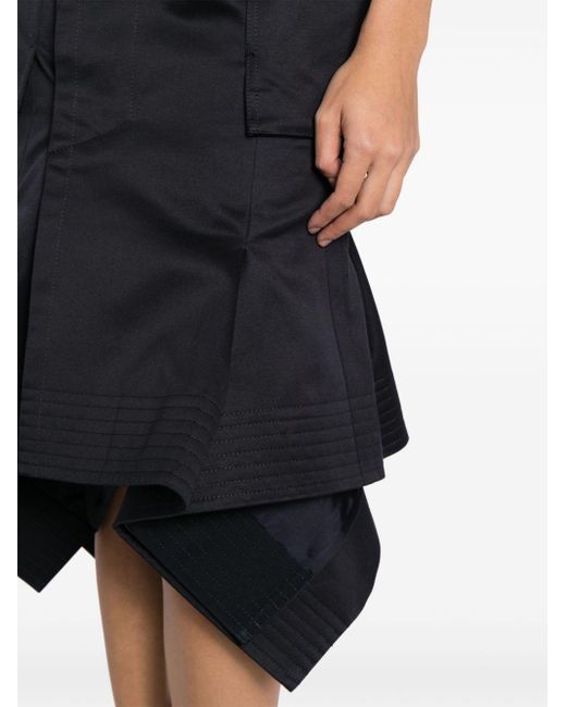 Jupe asymétrique à poches cargo Sacai en coloris Black