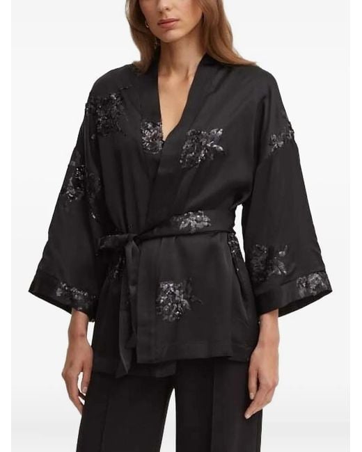 Top de satén con lentejuelas Sandro Ferrone de color Black