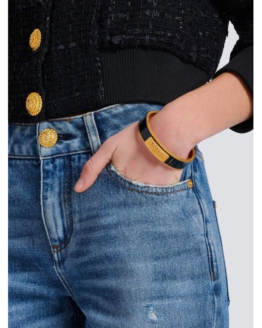 Bracelet signature tubular en laiton et émail Balmain en coloris Black