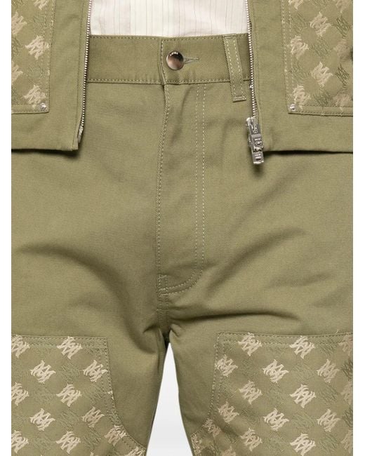 Amiri Green Monogram-Pattern Panelled Trousers for men