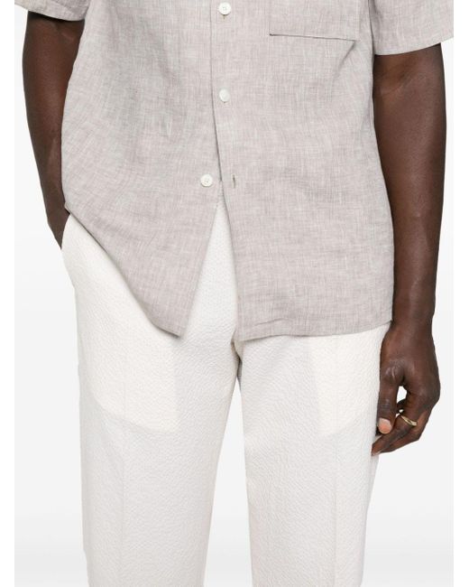 Tagliatore White Seersucker Tapered Trousers for men