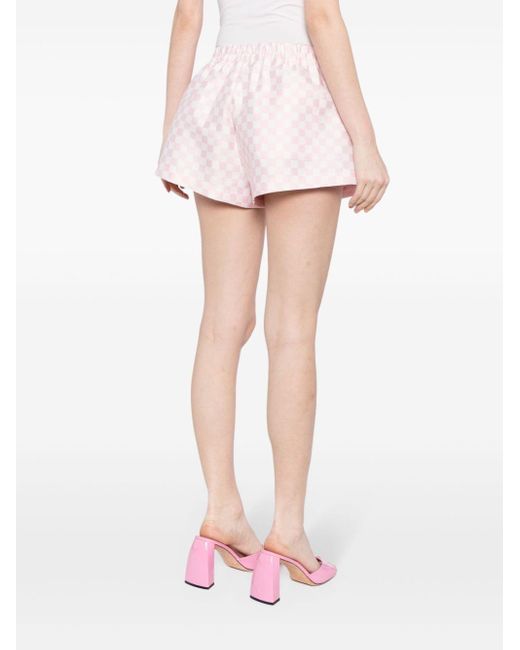 Checked logo-appliqué shorts di Versace in Pink