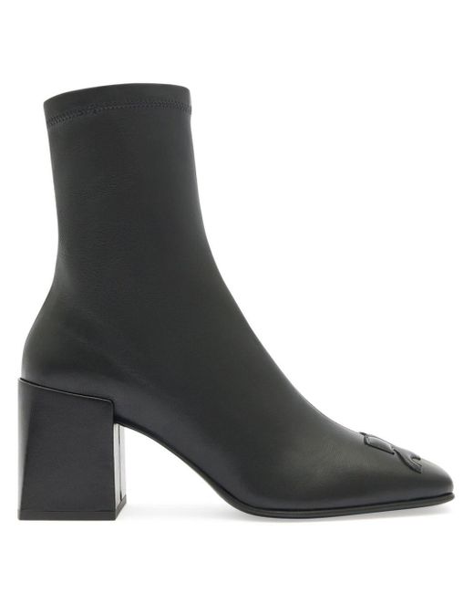 Leather block-heel ankle boots di Courreges in Black