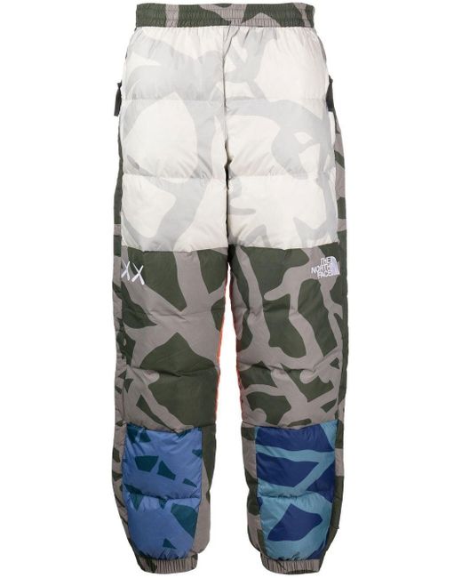 X KAWS pantalon Retro 1996 à design matelassé The North Face pour homme en coloris Blue
