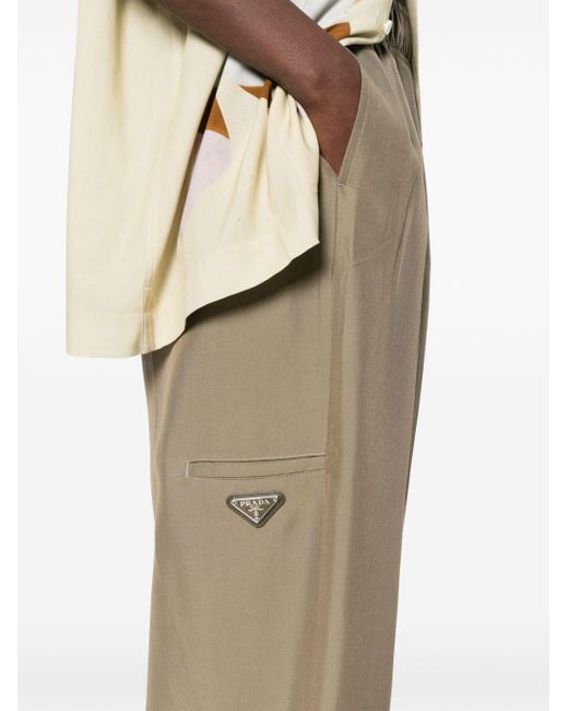 Pantalones con logo triangular esmaltado Prada de color Natural