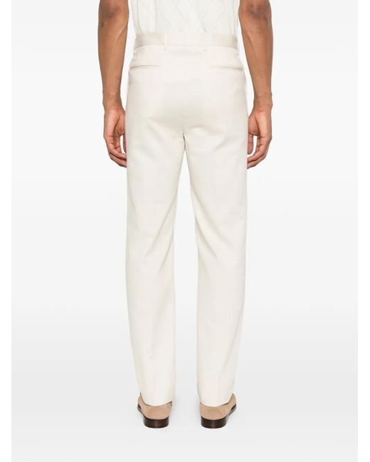 Corneliani White Buttoned Trousers for men