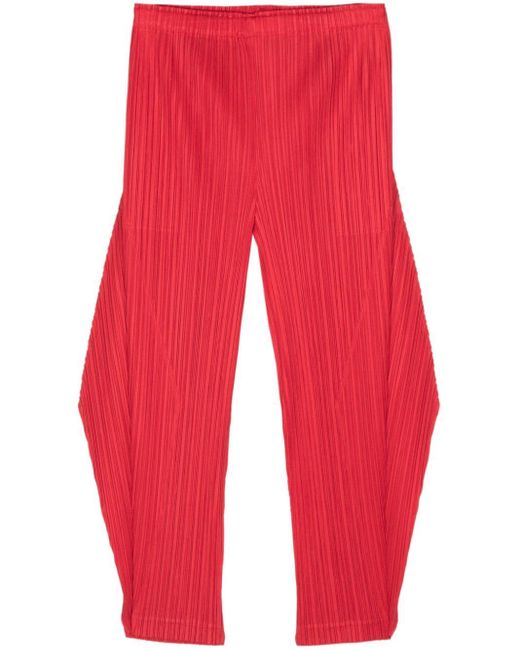 Pantalon fuselé à design plissé Pleats Please Issey Miyake en coloris Red