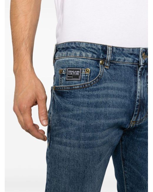 Versace Blue Logo-appliqué Slim-cut Jeans for men