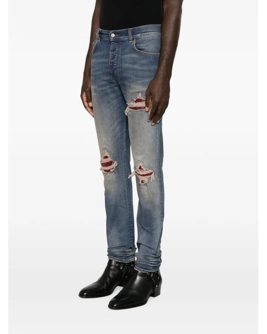 Amiri Blue Distressed Patchwork Jeans for men