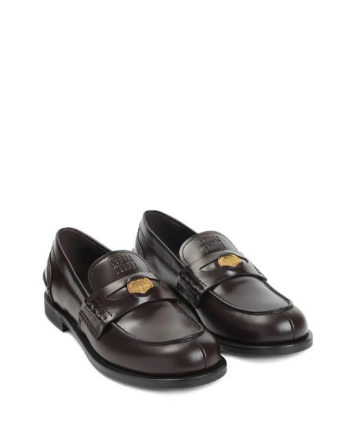 Mocasines penny de piel Miu Miu de color Black
