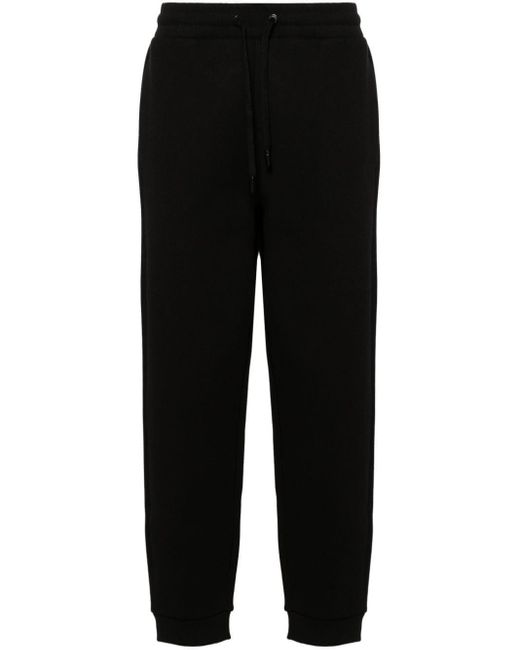 Pantalon de jogging à logo embossé AMI en coloris Black
