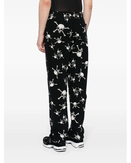 SAINT Mxxxxxx Black Skull-Print Cotton Track Pants for men