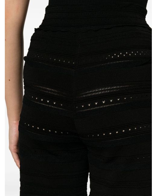 Pantalon superposé à détails de perforations Sandro en coloris Black