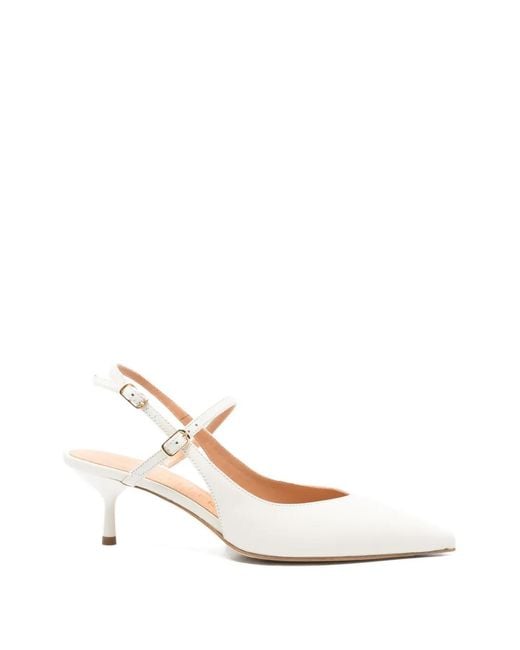The Seller White Slingback Pumps
