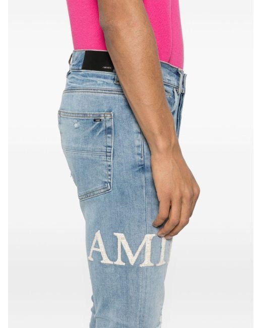 Amiri Blue Mx1 Bouclé-logo Skinny Jeans for men