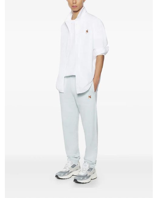 Maison Kitsuné White Logo-Patch Trousers for men