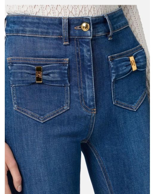 Vaqueros acampanados con detalle de lazo Elisabetta Franchi de color Blue
