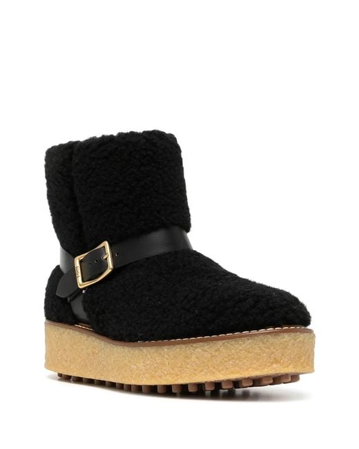 Tod's Black Platform Shearling Ankle Boots