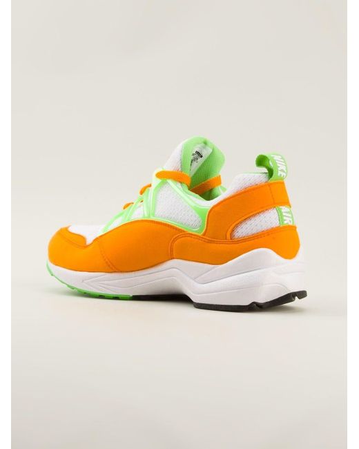 green and orange nike trainers