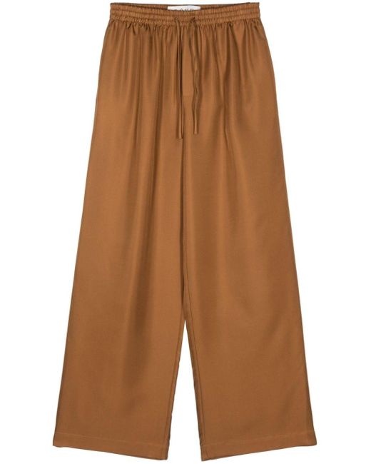 Pantalon en soie à taille élastiquée Rohe en coloris Brown