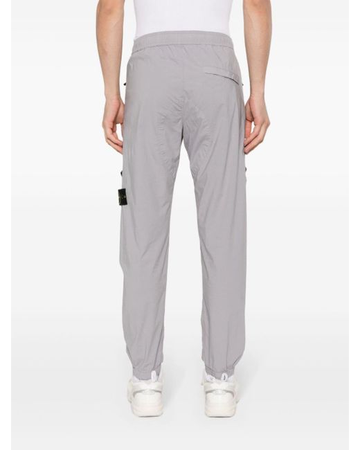 Pantalon de jogging à patch logo Stone Island pour homme en coloris Gray