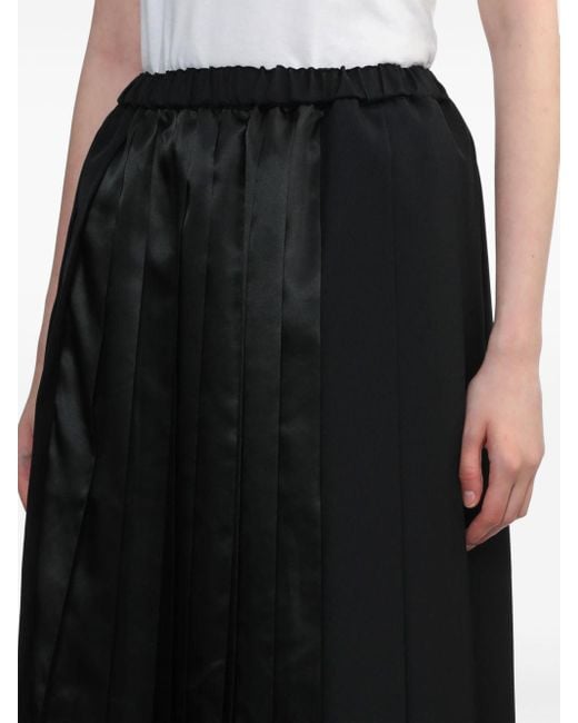 Jupe mi-longue à design plissé COMME DES GARÇON BLACK en coloris Black