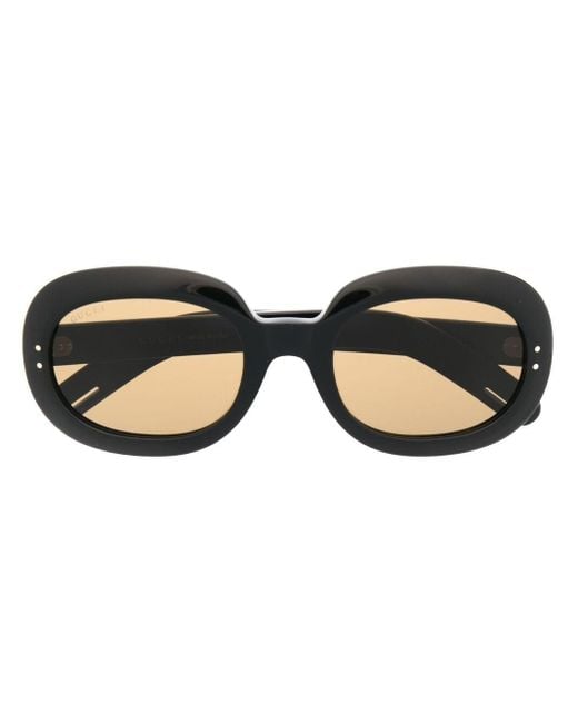 Occhiali da sole ovali di Gucci in Nero - Lyst