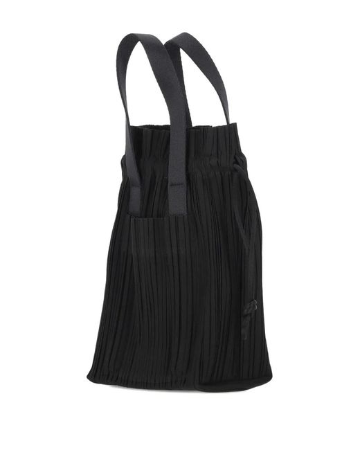 Pleats Please Issey Miyake Pleated Drawstring Tote Bag in Black | Lyst