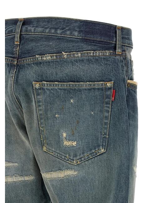 Undercover Blue Embroidered Distressed Jeans for men
