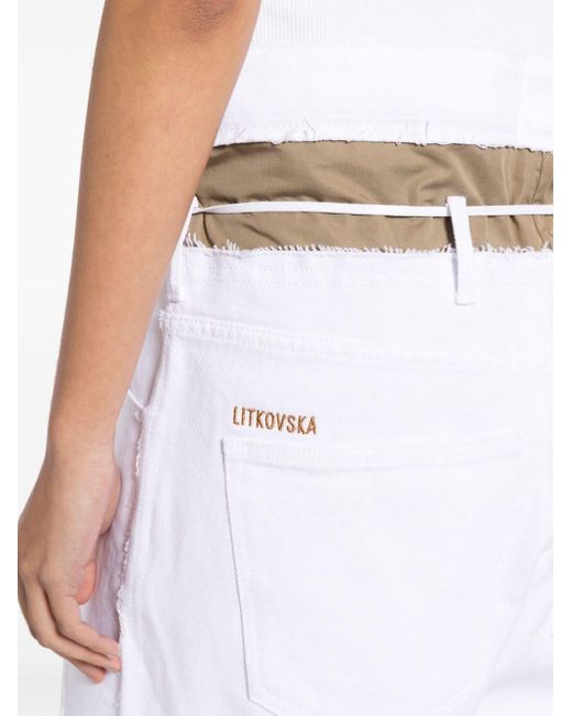 Short en jean asymétrique à bords francs Litkovskaya en coloris White